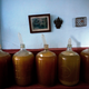 Several condom topped wine jugs stand in winemaker Orestes Estevez’ house. (AP Photo/Ramon Espinosa)